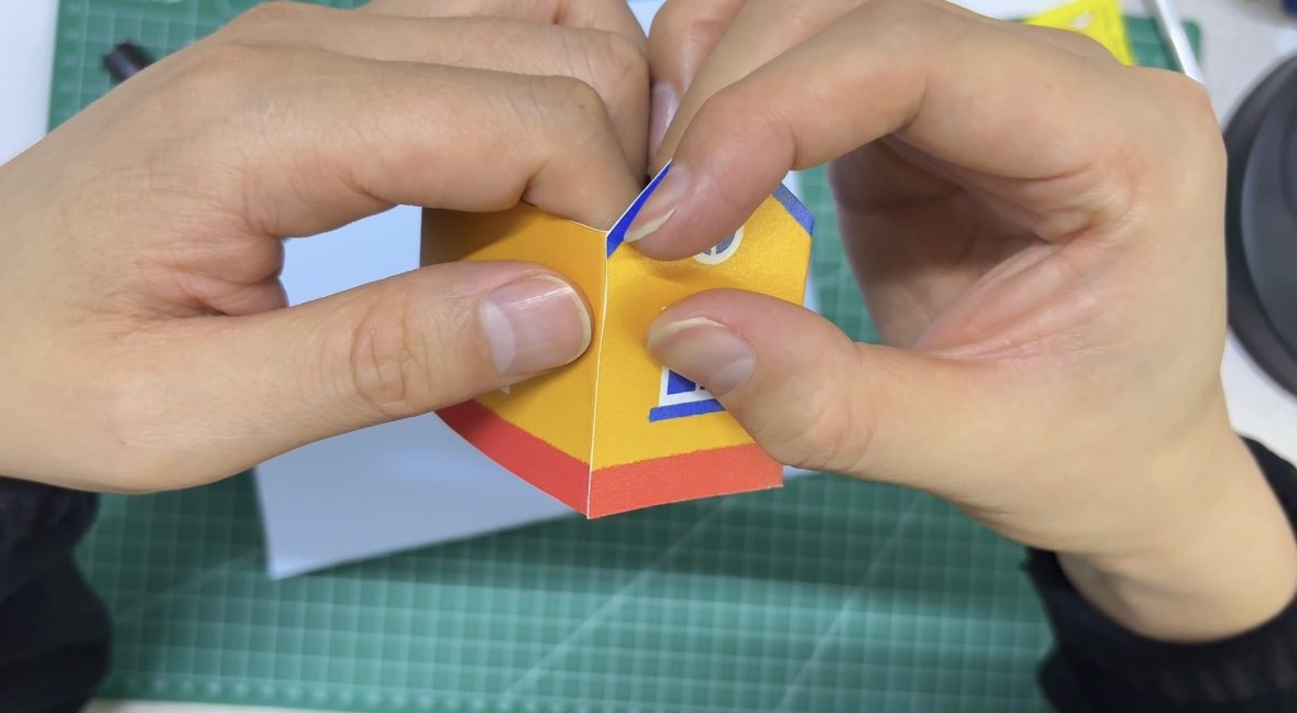 Aligning the pop-up house tabs near the center fold of the card